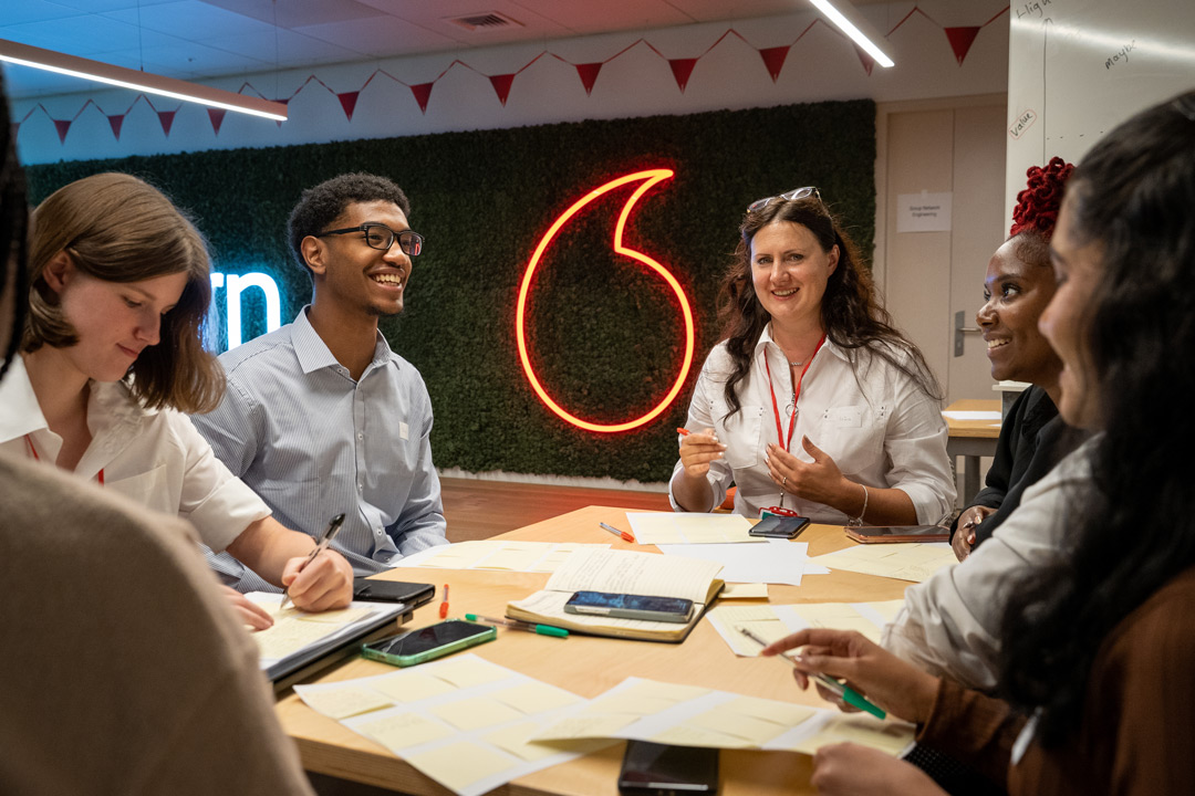 Vodafone apprentices in an office.